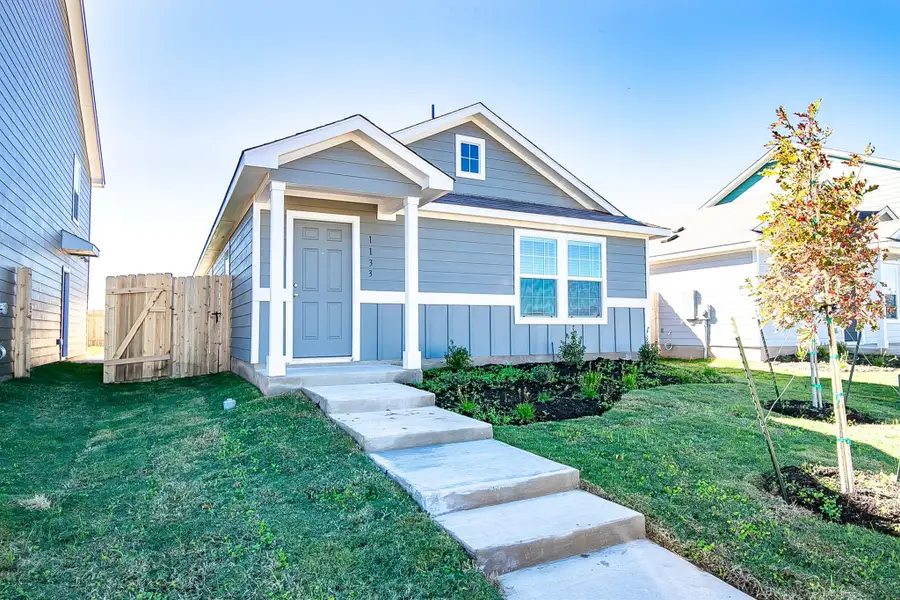 Front exterior of a new home in Bastrop Grove: Stonehill Collection, Bastrop, TX, highlighting curb appeal (Image 2).