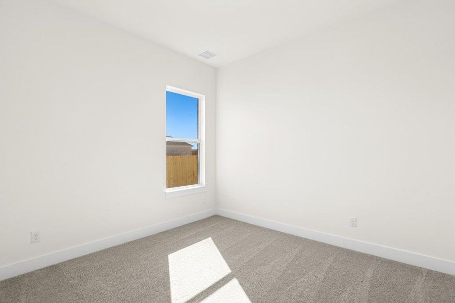 Empty room with baseboards and carpet flooring Empty room with baseboards and carpet flooring