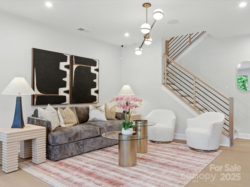 Elevated great room with open rail at oak box stairs. *Model Photos | Actual finishes, structural selections, and orientation may vary. Elevated great room with open rail at oak box stairs. *Model Photos | Actual finishes, structural selections, and orientation may vary.