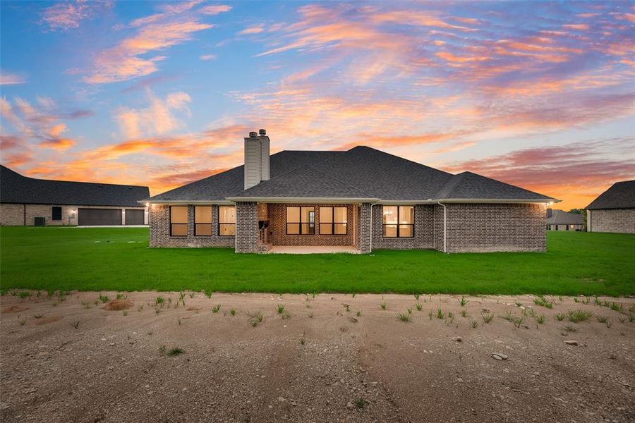 Front exterior of a new home in King Crossing Estates, Van Alstyne, TX, highlighting curb appeal (Image 16). Front exterior of a new home in King Crossing Estates, Van Alstyne, TX, highlighting curb appeal (Image 16).