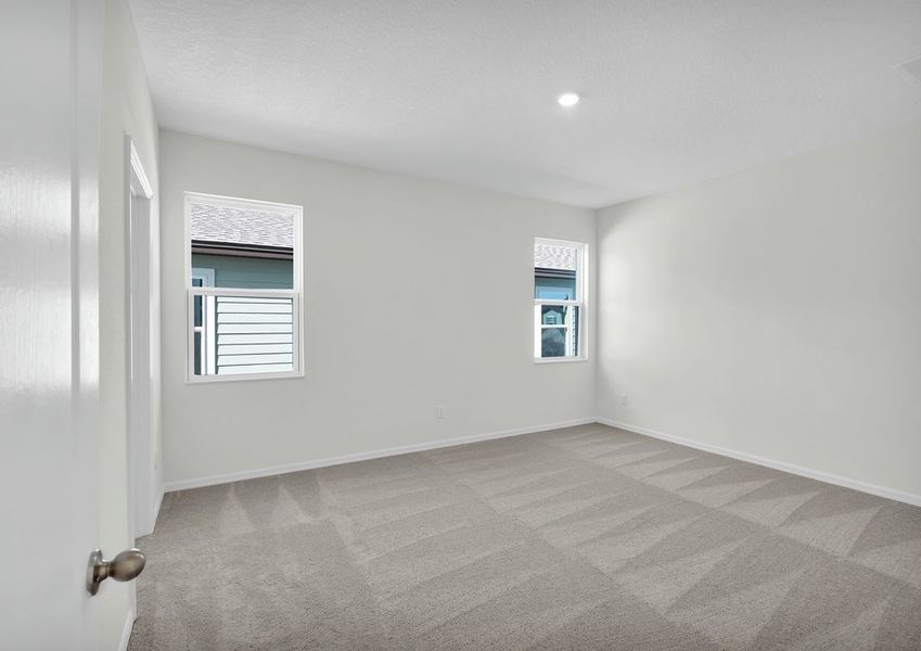 Rest and relaxation await in the master bedroom