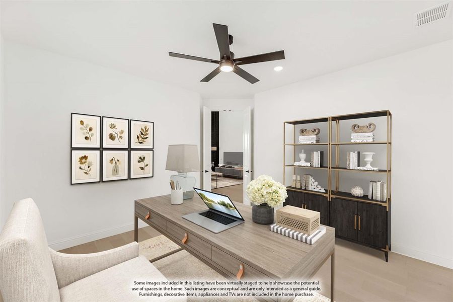 Home office with wood desk, ceiling fan, open shelving unit, and botanical wall art
