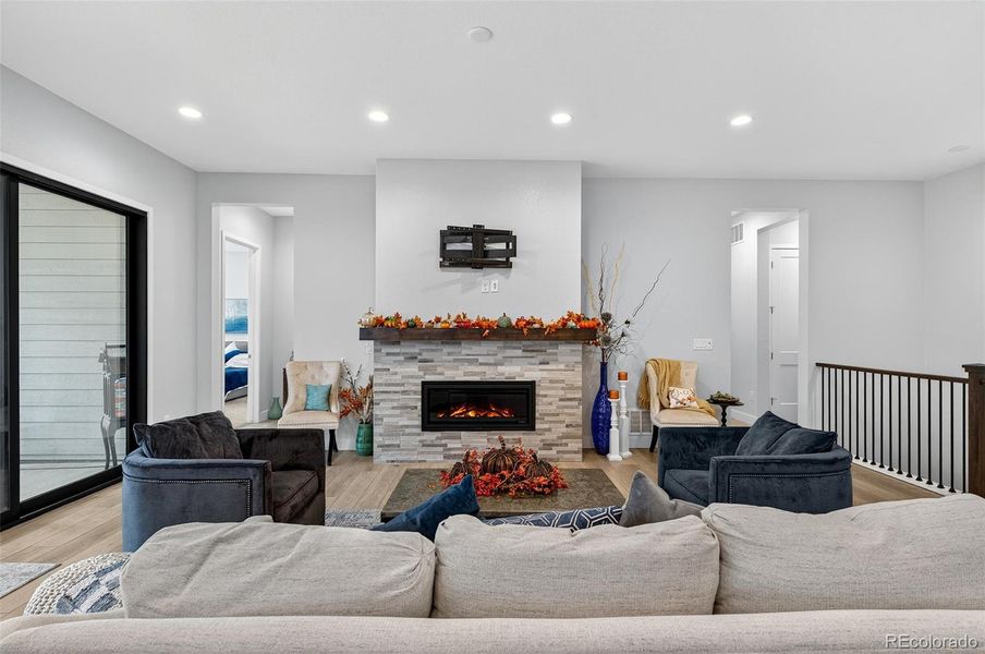 Living Room (Angle 2) – The fireplace serves as a focal point in this cozy yet spacious living room, framed by neutral walls and stylish décor.
