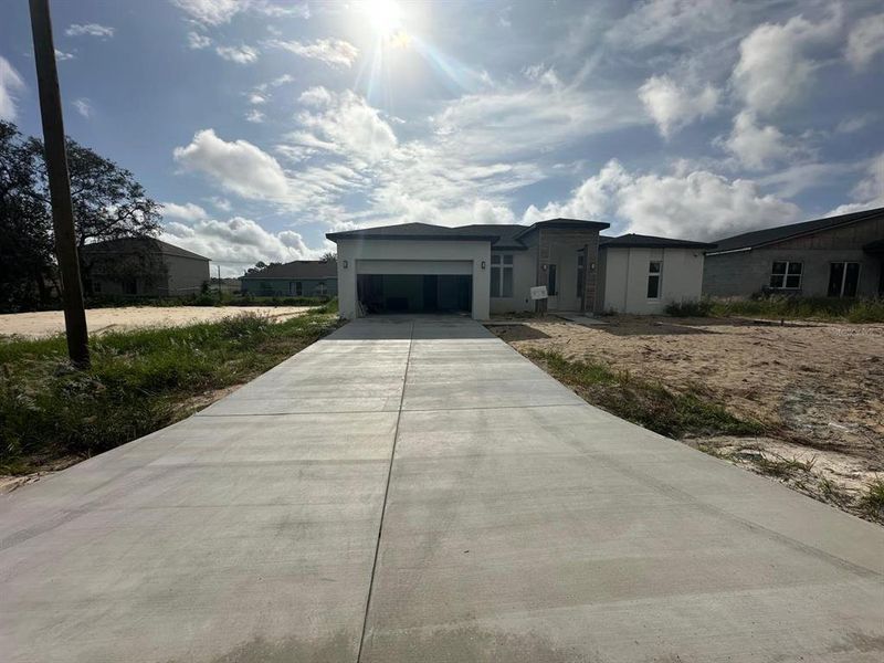 Front exterior of a new home in , Kissimmee, FL, highlighting curb appeal (Image 2). Front exterior of a new home in , Kissimmee, FL, highlighting curb appeal (Image 2).