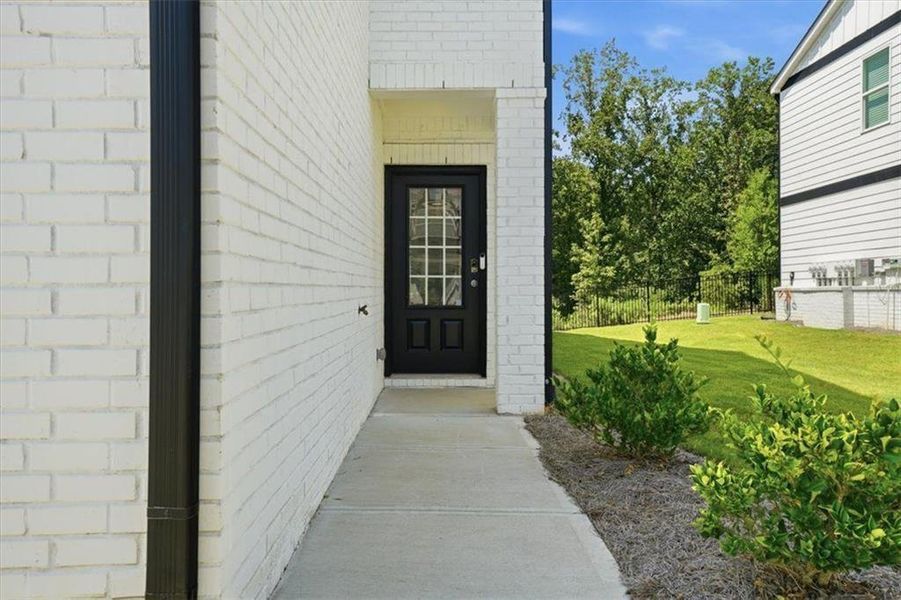 Exterior details and patio area of a home in Brooks at Riverview Landing, Smyrna (Image 4).