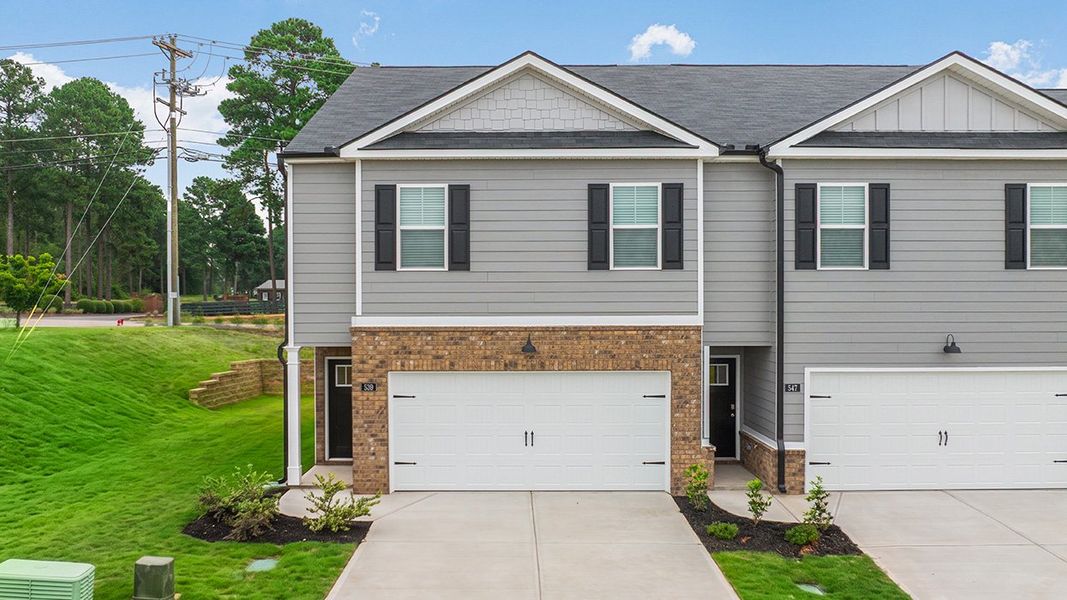 Front exterior of a new home in Highland Hills, Graniteville, SC, highlighting curb appeal (Image 1). Front exterior of a new home in Highland Hills, Graniteville, SC, highlighting curb appeal (Image 1).