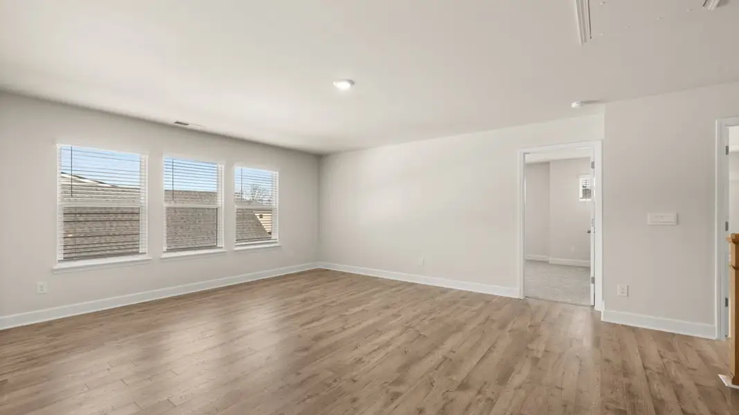 Representative unfurnished interior of a home built from the Hampshire by D.R. Horton in Heritage Pointe, Senoia (Image 29).