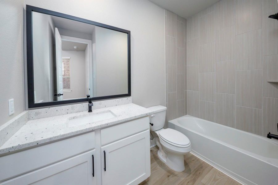 Each bathroom has expansive vanities offering an abundance of storage below. Each bathroom has expansive vanities offering an abundance of storage below.