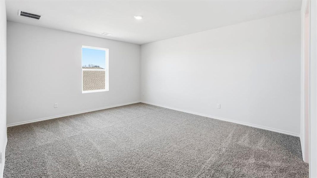 Empty room with light carpet and baseboards