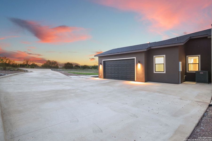 Front exterior of a new home in , Spring Branch, TX, highlighting curb appeal (Image 22).