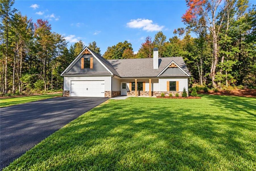 Front exterior of a new home in , Silver Creek, GA, highlighting curb appeal (Image 1). Front exterior of a new home in , Silver Creek, GA, highlighting curb appeal (Image 1).
