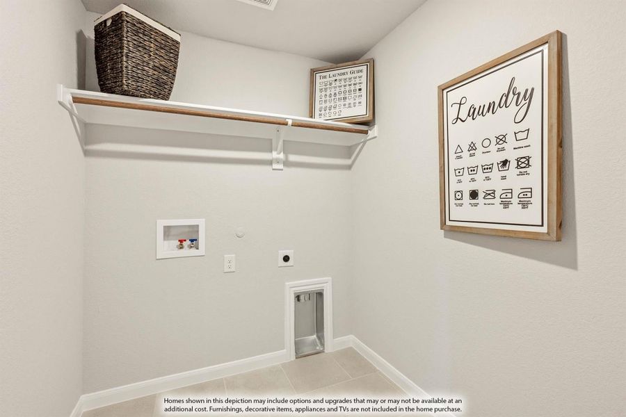 Laundry room with upper shelf, washer hookups, dryer outlet, and decorative wall sign Laundry room with upper shelf, washer hookups, dryer outlet, and decorative wall sign
