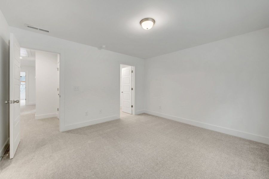 Spacious, unfurnished interior of a new home in Ashmore Townes, Garner (Image 20).