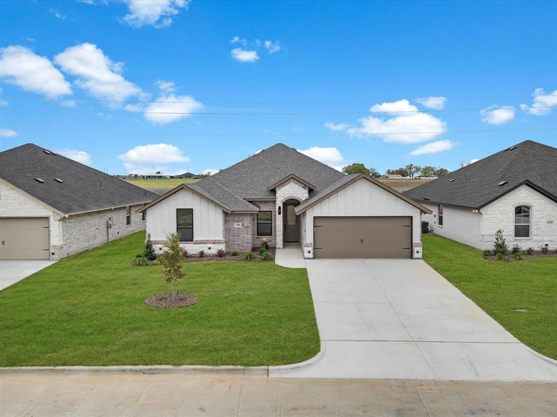 Front exterior of a new home in , Tolar, TX, highlighting curb appeal (Image 19).