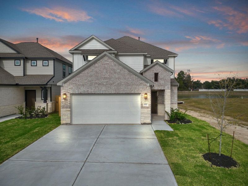 Front exterior of a new home in Cypresswood Landing, Humble, TX, highlighting curb appeal (Image 21).