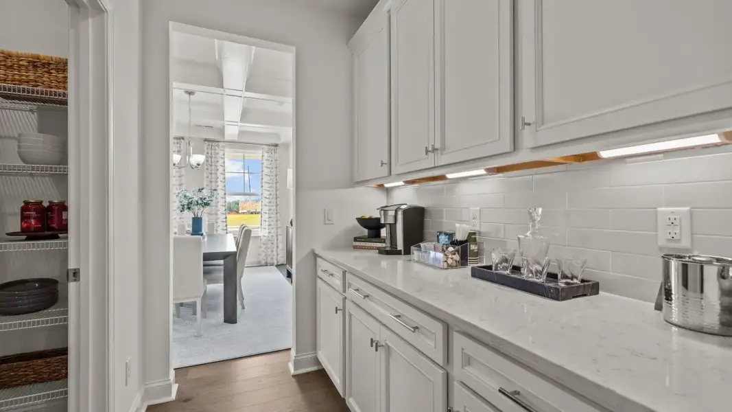 Exclusive butler's pantry with under-cabinet lighting and quartz counter tops in the Townsend Design by DRB Homes in York, SC Exclusive butler's pantry with under-cabinet lighting and quartz counter tops in the Townsend Design by DRB Homes in York, SC
