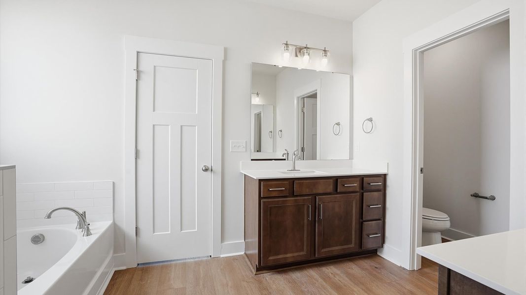 Tasteful primary bath with modern finishes, a walk-in shower, and thoughtful layout located in Woodruff, SC Tasteful primary bath with modern finishes, a walk-in shower, and thoughtful layout located in Woodruff, SC