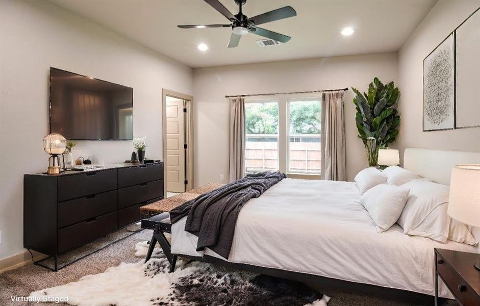Bedroom featuring a ceiling fan, recessed lighting, and carpet floors
