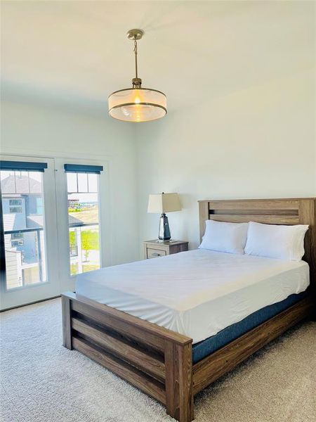 Bedroom featuring light colored carpet Bedroom featuring light colored carpet