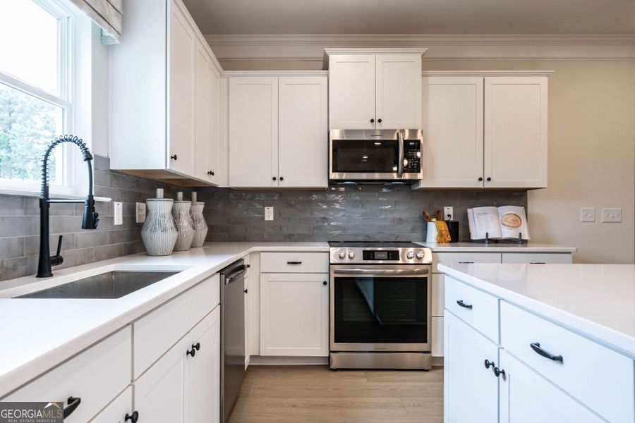 Furnished interior view inside a new home in Cobblestone Crossing Commons, Byron (Image 10).