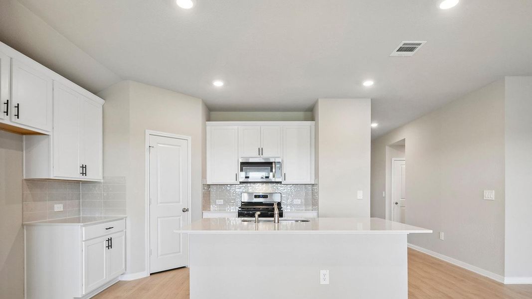 Furnished interior view inside a new home in Carillon, Manor (Image 8).
