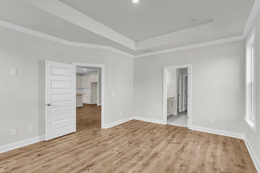 Spacious, unfurnished interior of a new home in Tidewater at Lakes of Cane Bay, Summerville (Image 26).