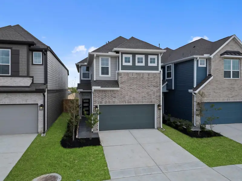 Front exterior of a new home in Bridgeland, Cypress, TX, highlighting curb appeal (Image 2). Front exterior of a new home in Bridgeland, Cypress, TX, highlighting curb appeal (Image 2).