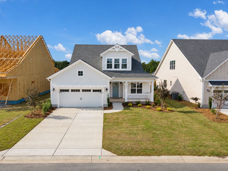 Front exterior of a new home in Sidbury Landing, Wilmington, NC, highlighting curb appeal (Image 21).