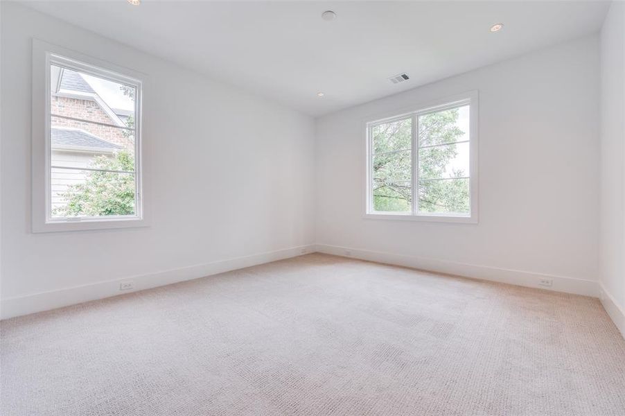 Spare room with light colored carpet