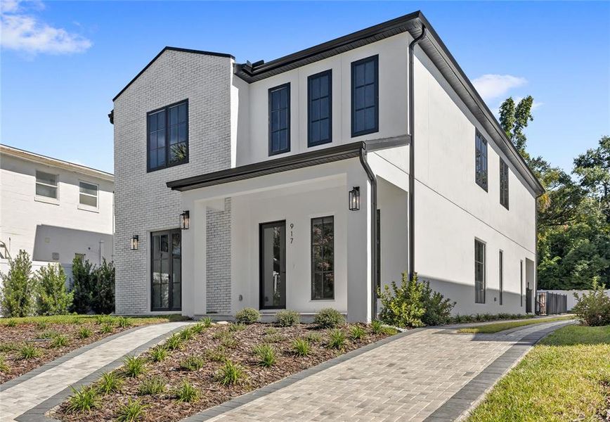 Front exterior of a new home in , Orlando, FL, highlighting curb appeal (Image 30). Front exterior of a new home in , Orlando, FL, highlighting curb appeal (Image 30).