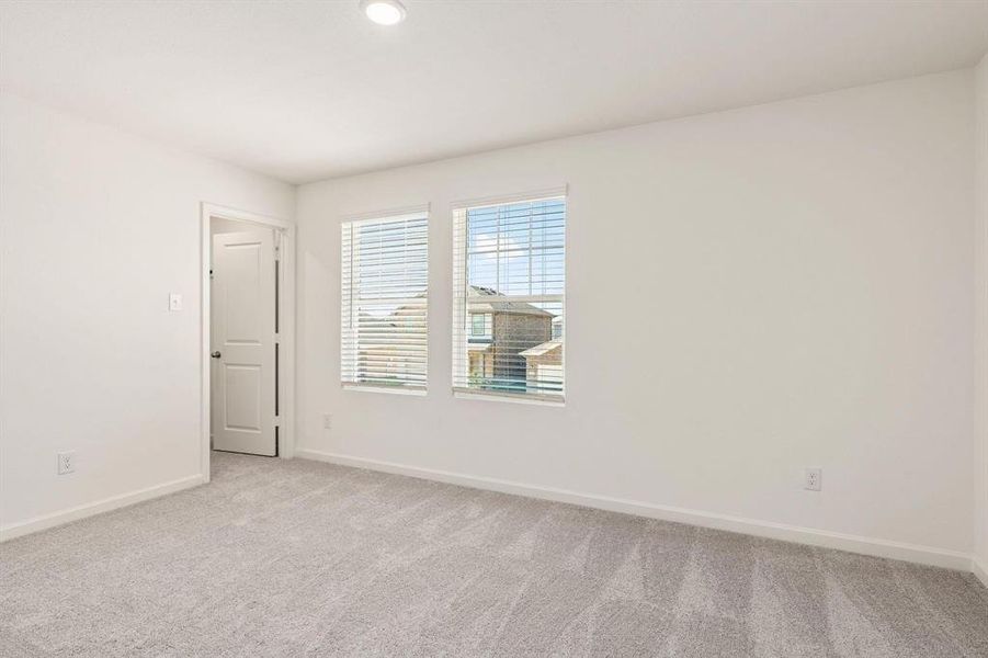 Empty room with light carpet and recessed lighting Empty room with light carpet and recessed lighting