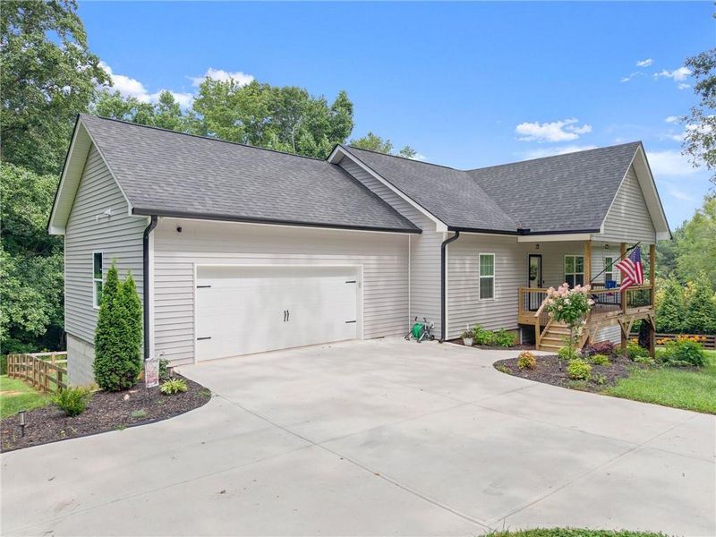 Front exterior of a new home in , Cumming, GA, highlighting curb appeal (Image 1). Front exterior of a new home in , Cumming, GA, highlighting curb appeal (Image 1).