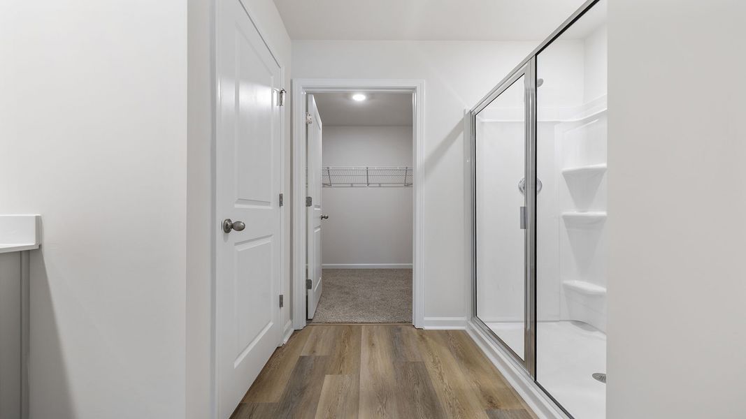 Spacious, unfurnished interior of a new home in Bentley Park, Greenwood (Image 31).