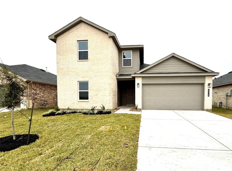 Front exterior of a new home in Porters Mill, New Caney, TX, highlighting curb appeal (Image 1). Front exterior of a new home in Porters Mill, New Caney, TX, highlighting curb appeal (Image 1).