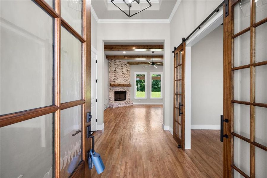 Study features coffered ceilings and French doors