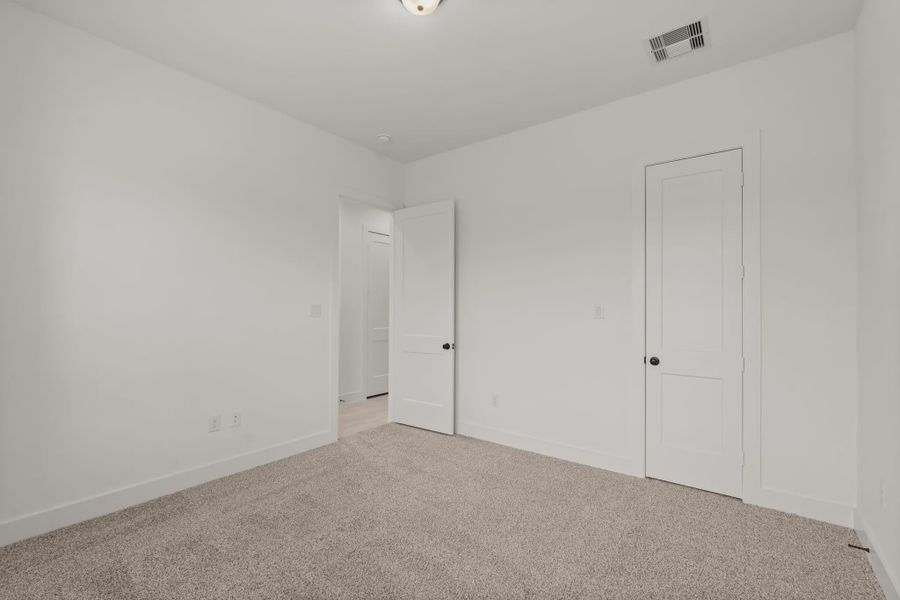 Representative unfurnished interior of a home built from the Sorenstam by Chesmar Homes in Riceland Alley Loads, Mont Belvieu (Image 68).