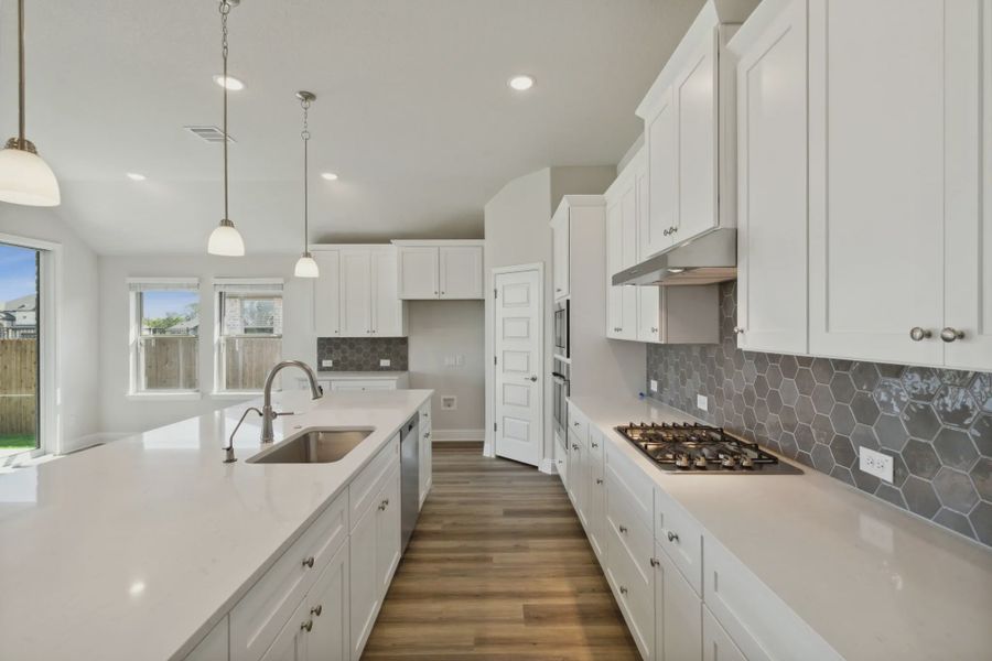 Representative furnished interior of a home built from the Raleigh by Chesmar Homes in Oaks of North Grove, Waxahachie (Image 4).