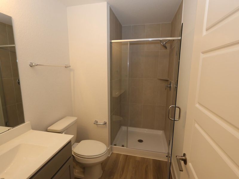 Furnished interior view inside a new home in Lone Star Landing, Montgomery (Image 9).