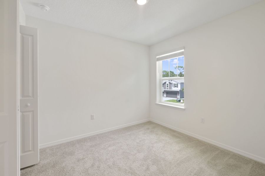 Spacious, unfurnished interior of a new home in Towns at Riverwalk, Sanford (Image 23).