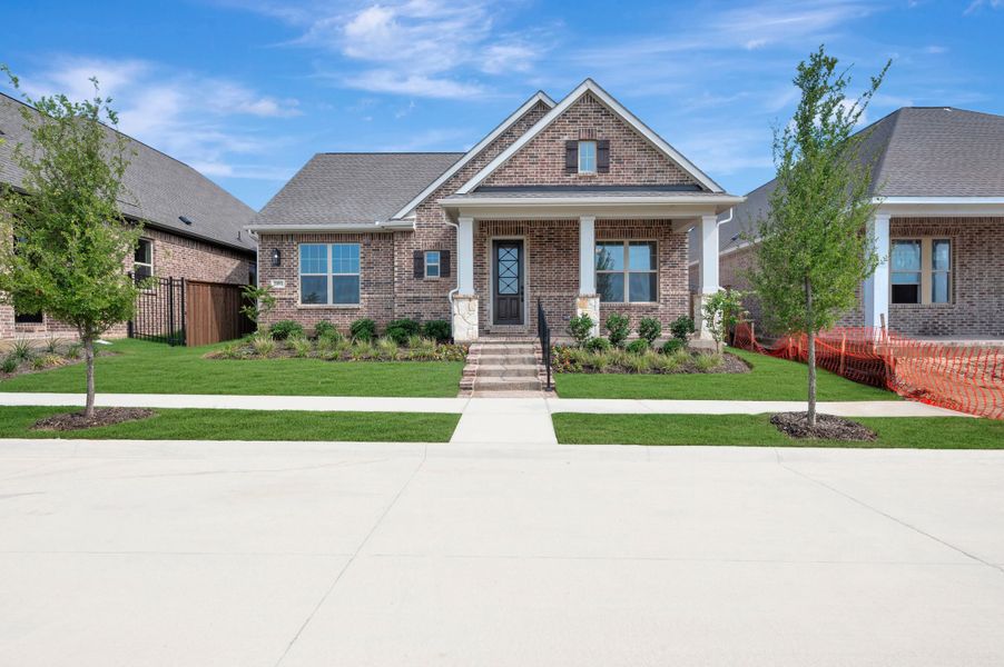 Front exterior of a new home in Elements at Viridian - Traditional Series, Arlington, TX, highlighting curb appeal (Image 2). Front exterior of a new home in Elements at Viridian - Traditional Series, Arlington, TX, highlighting curb appeal (Image 2).