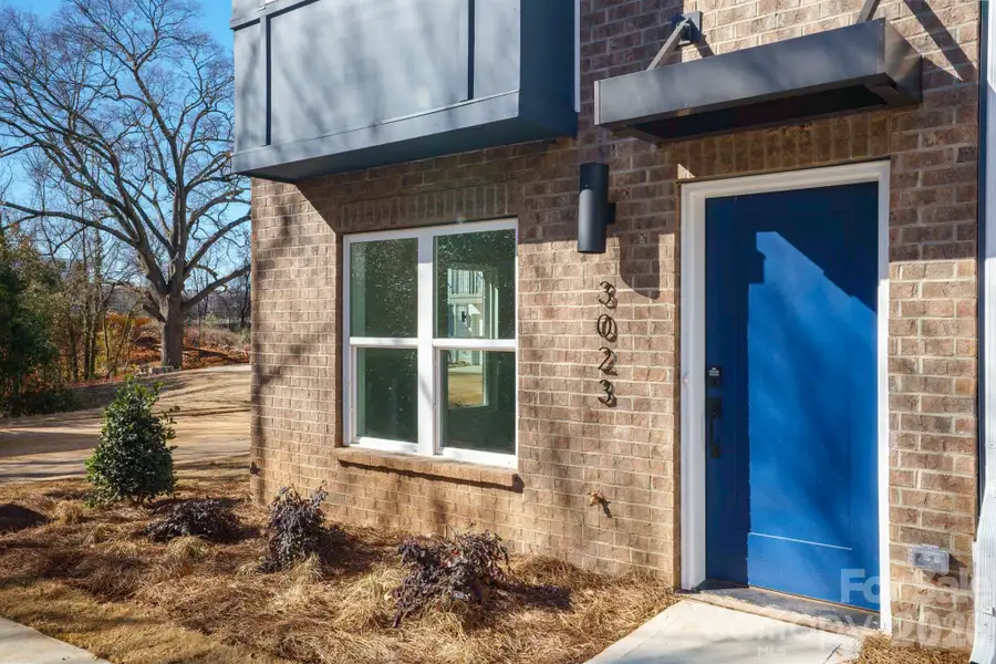 Modern four-level townhome featuring striking contemporary architecture and a prime Charlotte location close to shopping, dining, entertainment, and major commuter routes. Modern four-level townhome featuring striking contemporary architecture and a prime Charlotte location close to shopping, dining, entertainment, and major commuter routes.