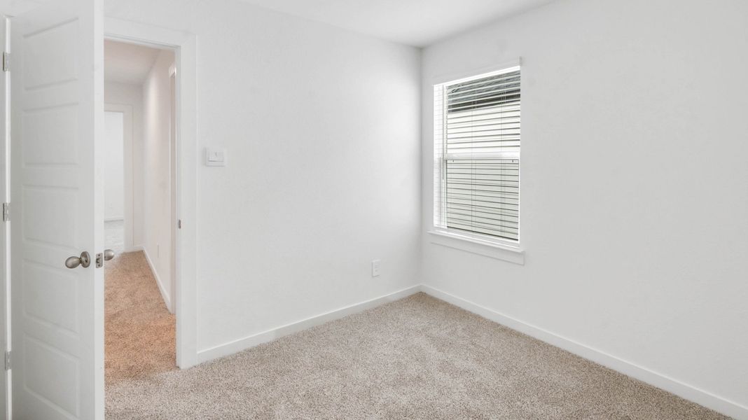 Representative unfurnished interior of a home built from the Jasmine by D.R. Horton in Grand West, Houston (Image 23).