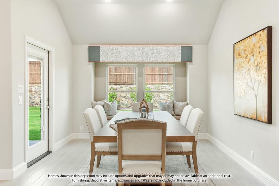 Dining room with rectangular table, upholstered chairs, window bench seating, and backyard door access Dining room with rectangular table, upholstered chairs, window bench seating, and backyard door access