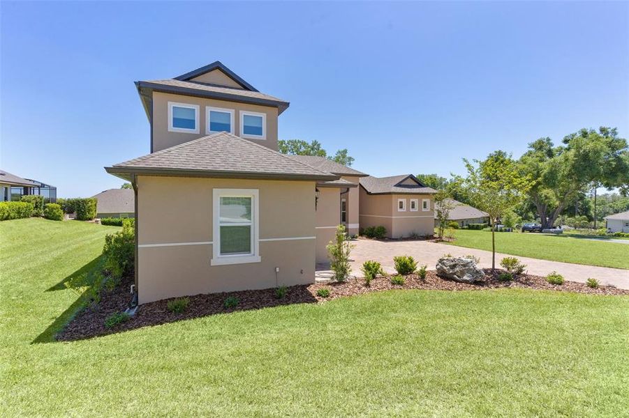 Front exterior of a new home in , Lady Lake, FL, highlighting curb appeal (Image 27).