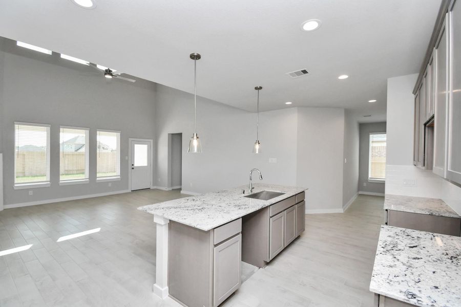 This generously spacious kitchen is a dream realized! Sample photo of completed home with similar floor plan. Actual colors and selections may vary. This generously spacious kitchen is a dream realized! Sample photo of completed home with similar floor plan. Actual colors and selections may vary.