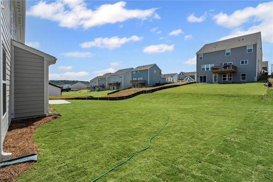 Front exterior of a new home in Twin Lakes, Hoschton, GA, highlighting curb appeal (Image 17). Front exterior of a new home in Twin Lakes, Hoschton, GA, highlighting curb appeal (Image 17).