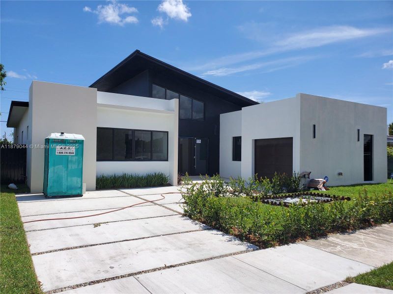Front exterior of a new home in , Miami, FL, highlighting curb appeal (Image 1). Front exterior of a new home in , Miami, FL, highlighting curb appeal (Image 1).