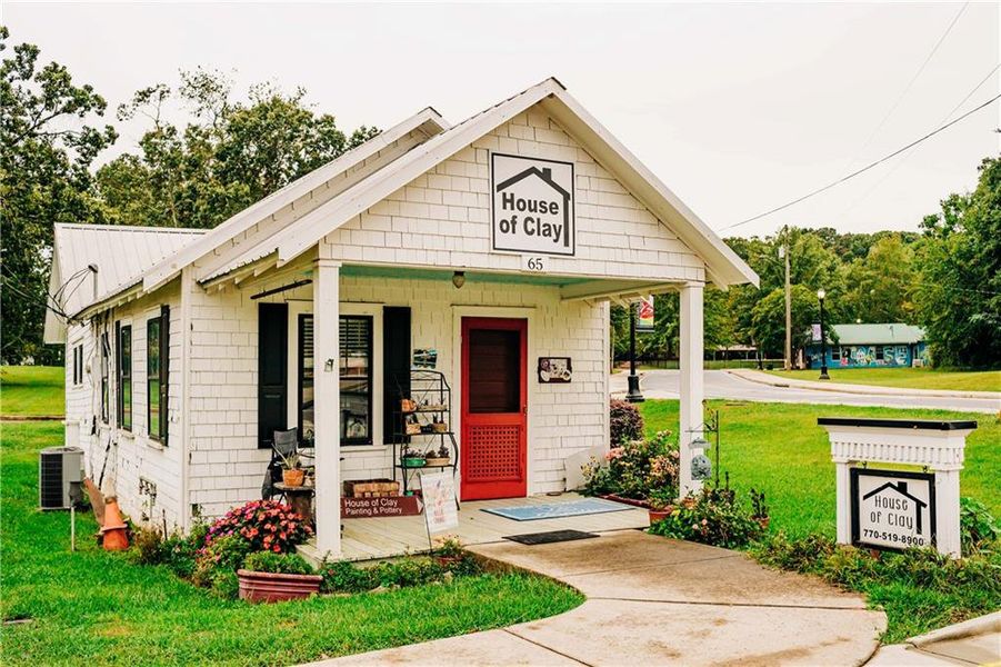 Front exterior of a new home in Rosewood Lake Estates, Hoschton, GA, highlighting curb appeal (Image 75).