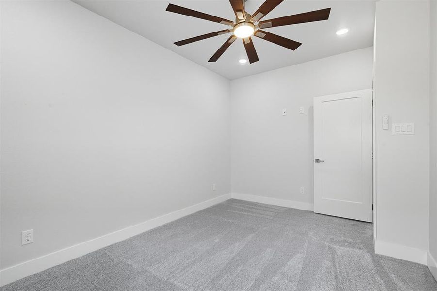 Spare room featuring light colored carpet, recessed lighting, and ceiling fan Spare room featuring light colored carpet, recessed lighting, and ceiling fan