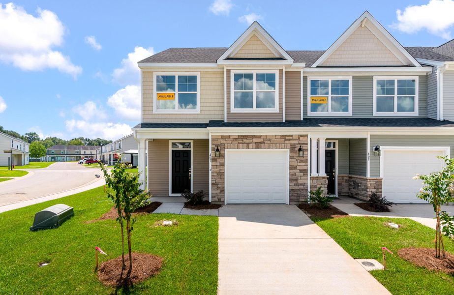 Front exterior of a new home in The Landings at Montague, Goose Creek, SC, highlighting curb appeal (Image 1). Front exterior of a new home in The Landings at Montague, Goose Creek, SC, highlighting curb appeal (Image 1).